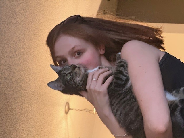 Ryleigh and her cat, Clover.